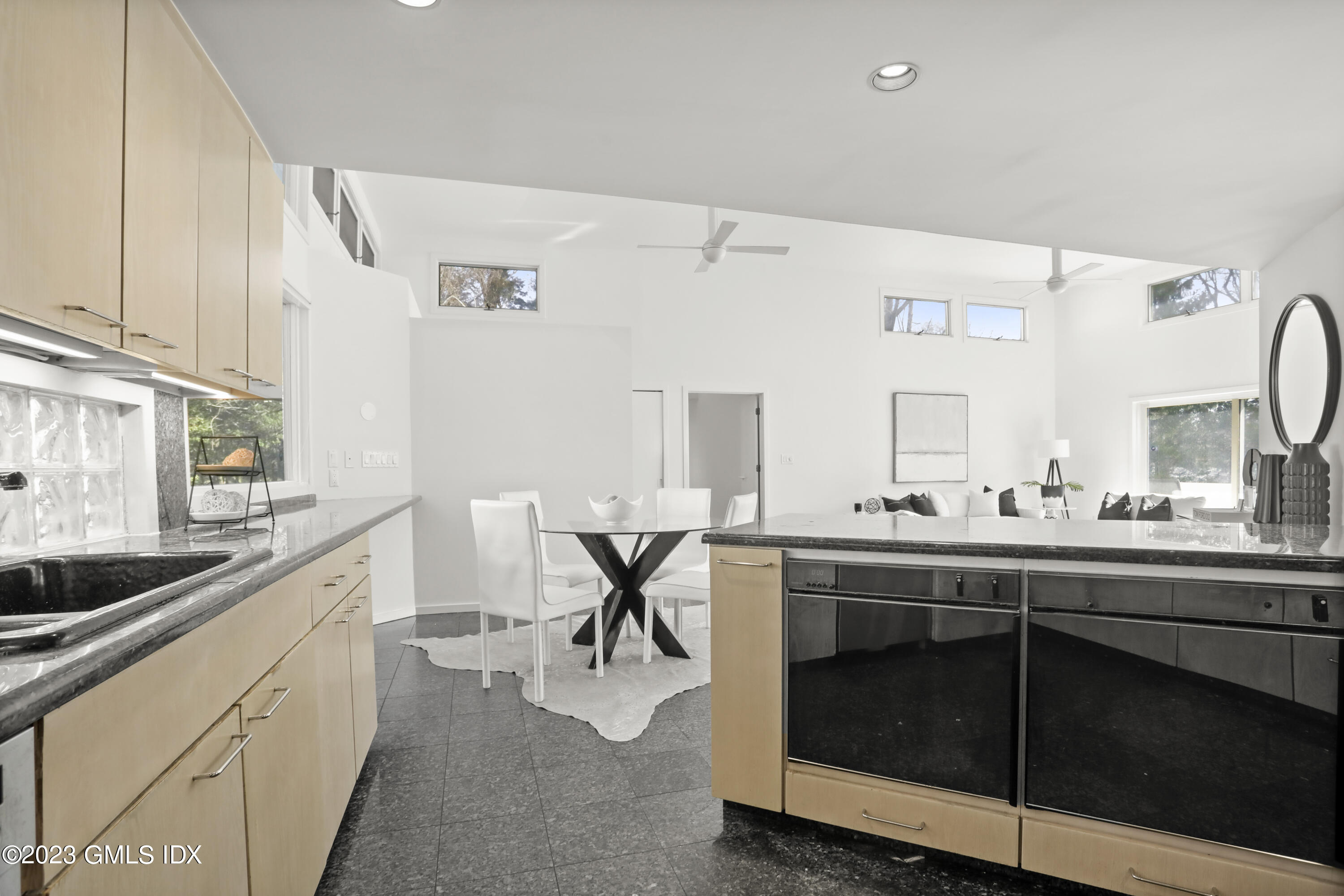 533 Cognewaugh Road Cos Cob, CT 06807 - Photo 8 of 21 a kitchen with a sink and cabinets