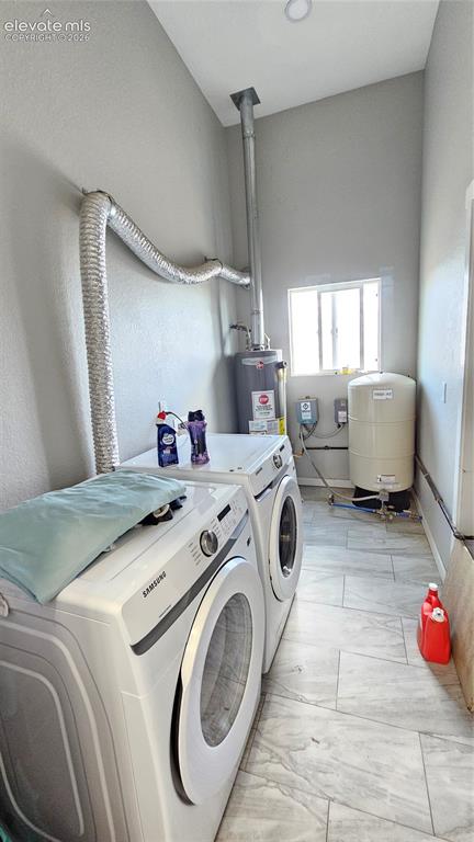 3835 Sengbeil Road Yoder, CO 80864 - Photo 35 of 48 a utility room with dryer and washer