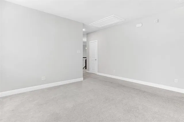 a bedroom with a bed and lamps