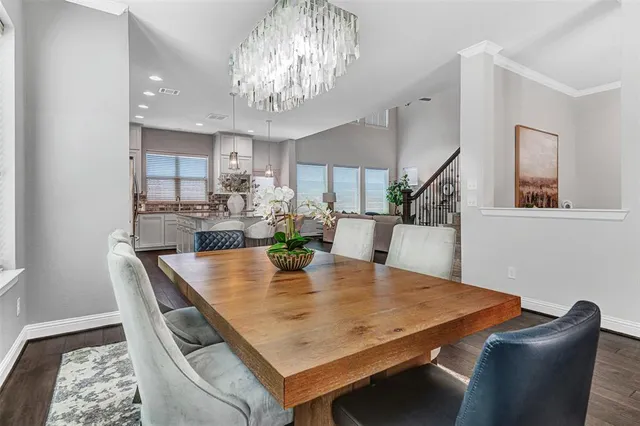 a kitchen with stainless steel appliances granite countertop a sink a stove top oven a counter space and cabinets