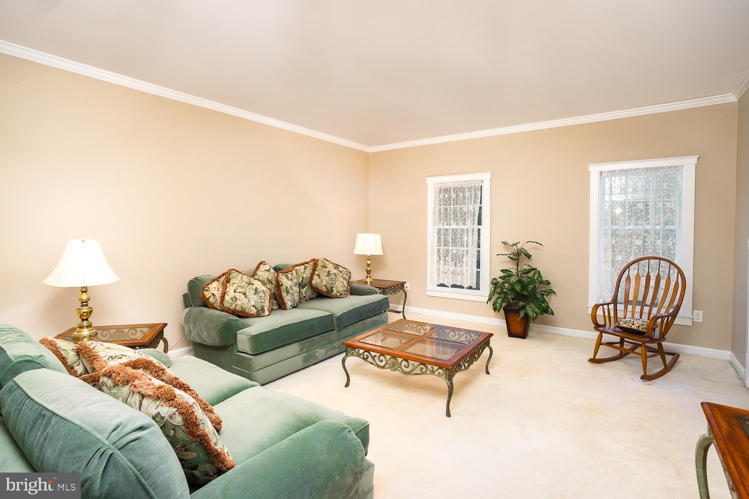 215 Yorkshire Terrace Wrightstown, NJ 08562 - Photo 12 of 43 a living room with furniture and a lamp