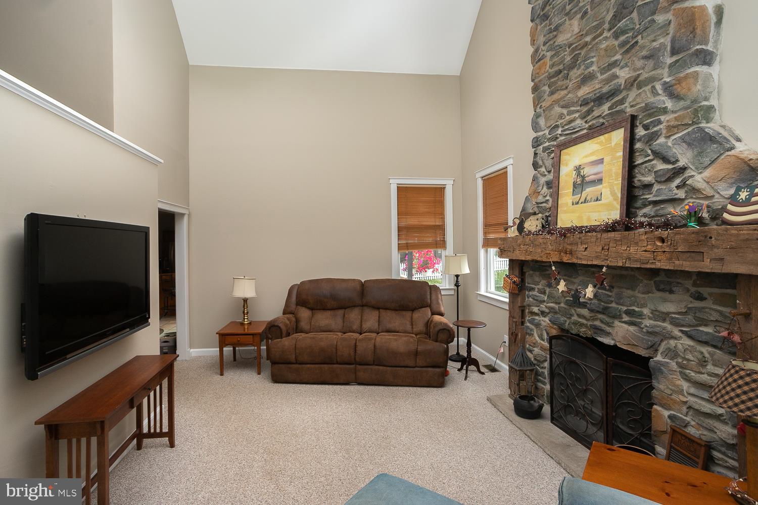 215 Yorkshire Terrace Wrightstown, NJ 08562 - Photo 14 of 43 a living room with furniture and a flat screen tv