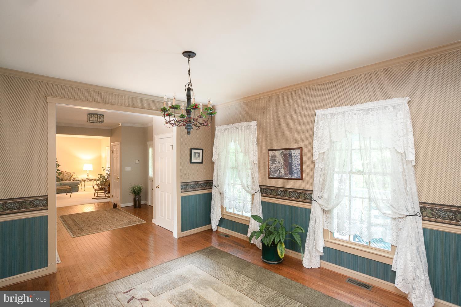 215 Yorkshire Terrace Wrightstown, NJ 08562 - Photo 21 of 43 a view of a livingroom with a chandelier fan and windows