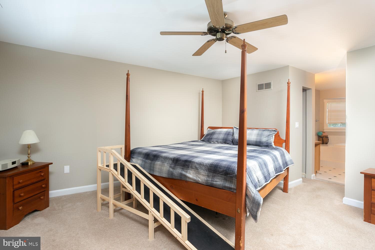 215 Yorkshire Terrace Wrightstown, NJ 08562 - Photo 22 of 43 a bedroom with a bed and a chandelier