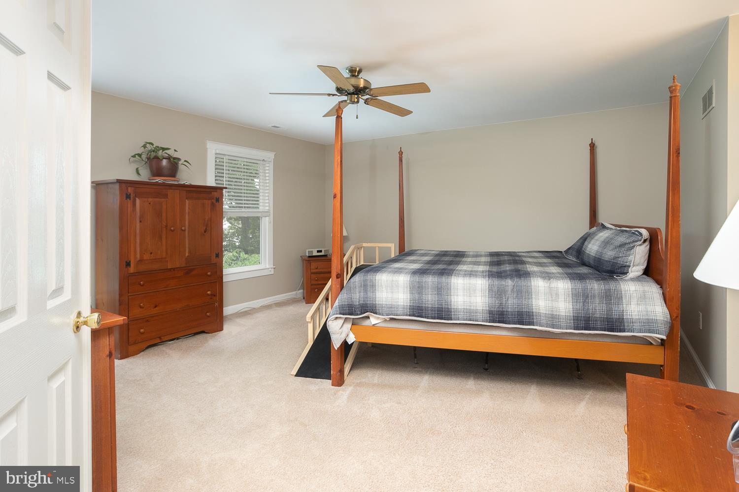 215 Yorkshire Terrace Wrightstown, NJ 08562 - Photo 23 of 43 a bedroom with a bed and a chandelier