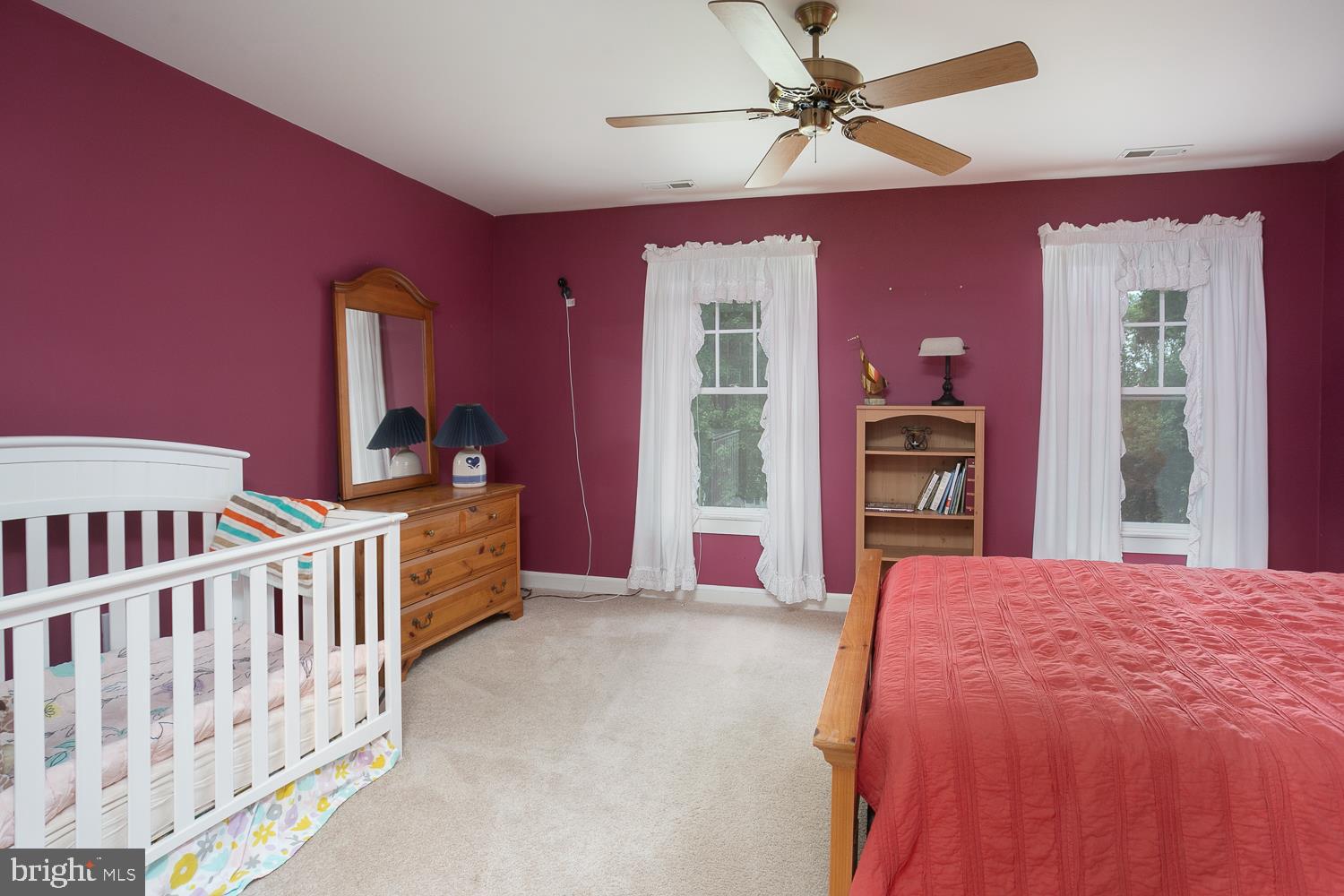 215 Yorkshire Terrace Wrightstown, NJ 08562 - Photo 31 of 43 a bed room with a bed and a chandelier