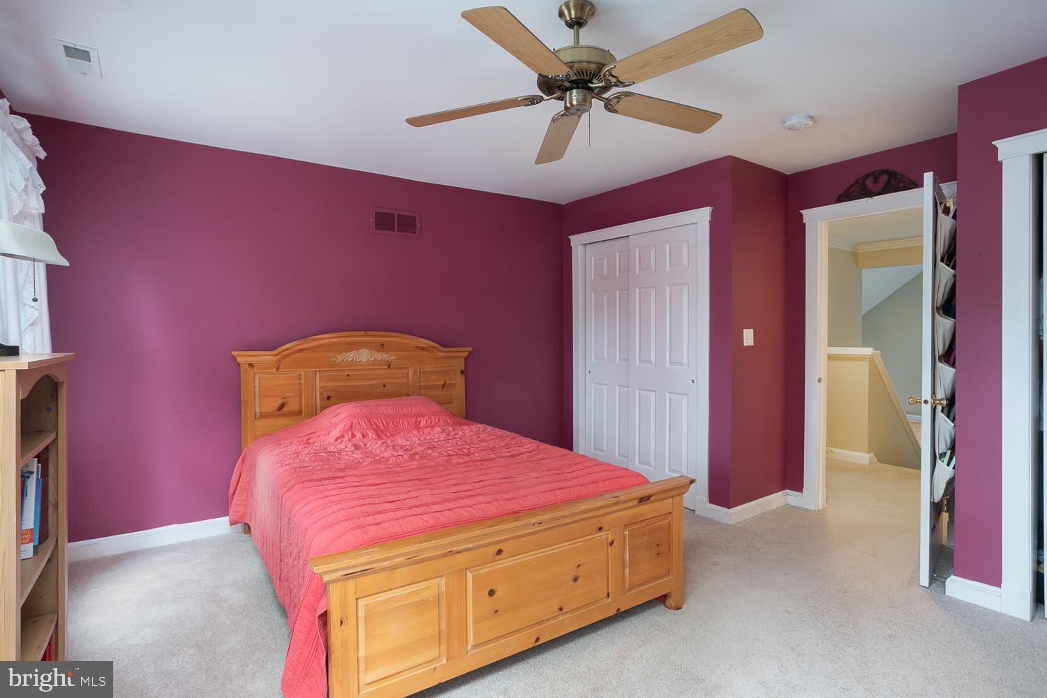 215 Yorkshire Terrace Wrightstown, NJ 08562 - Photo 32 of 43 a bedroom with a bed and a chandelier