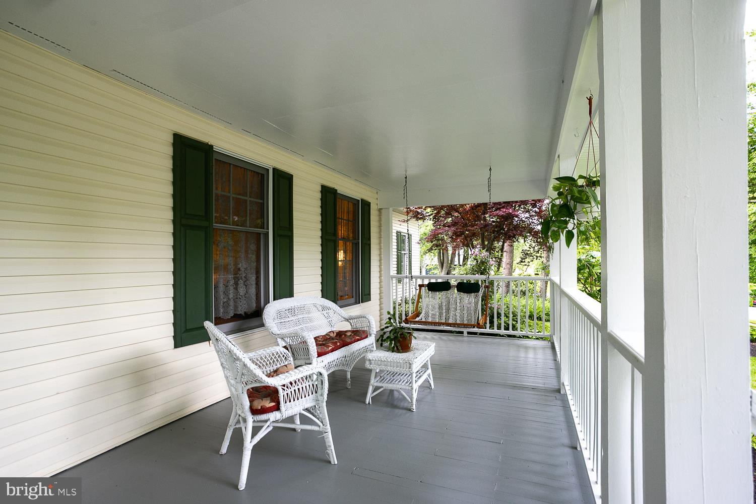 215 Yorkshire Terrace Wrightstown, NJ 08562 - Photo 6 of 43 a balcony with furniture and a potted plant