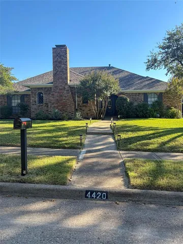 a view of swimming pool with a yard