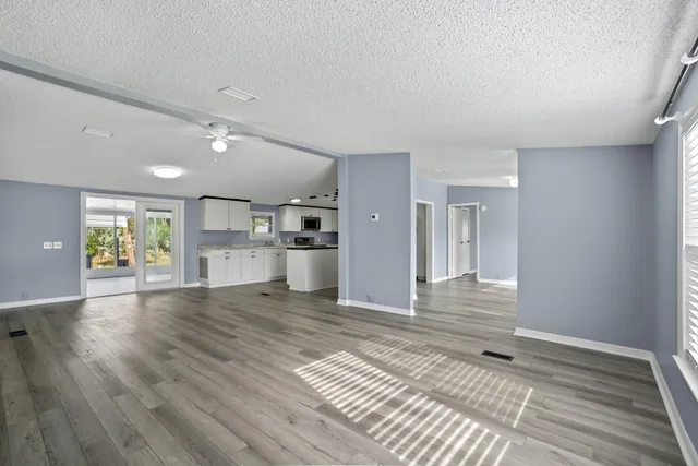 a kitchen with stainless steel appliances granite countertop a sink and stove top oven