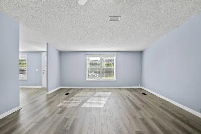a view of a livingroom with wooden floor