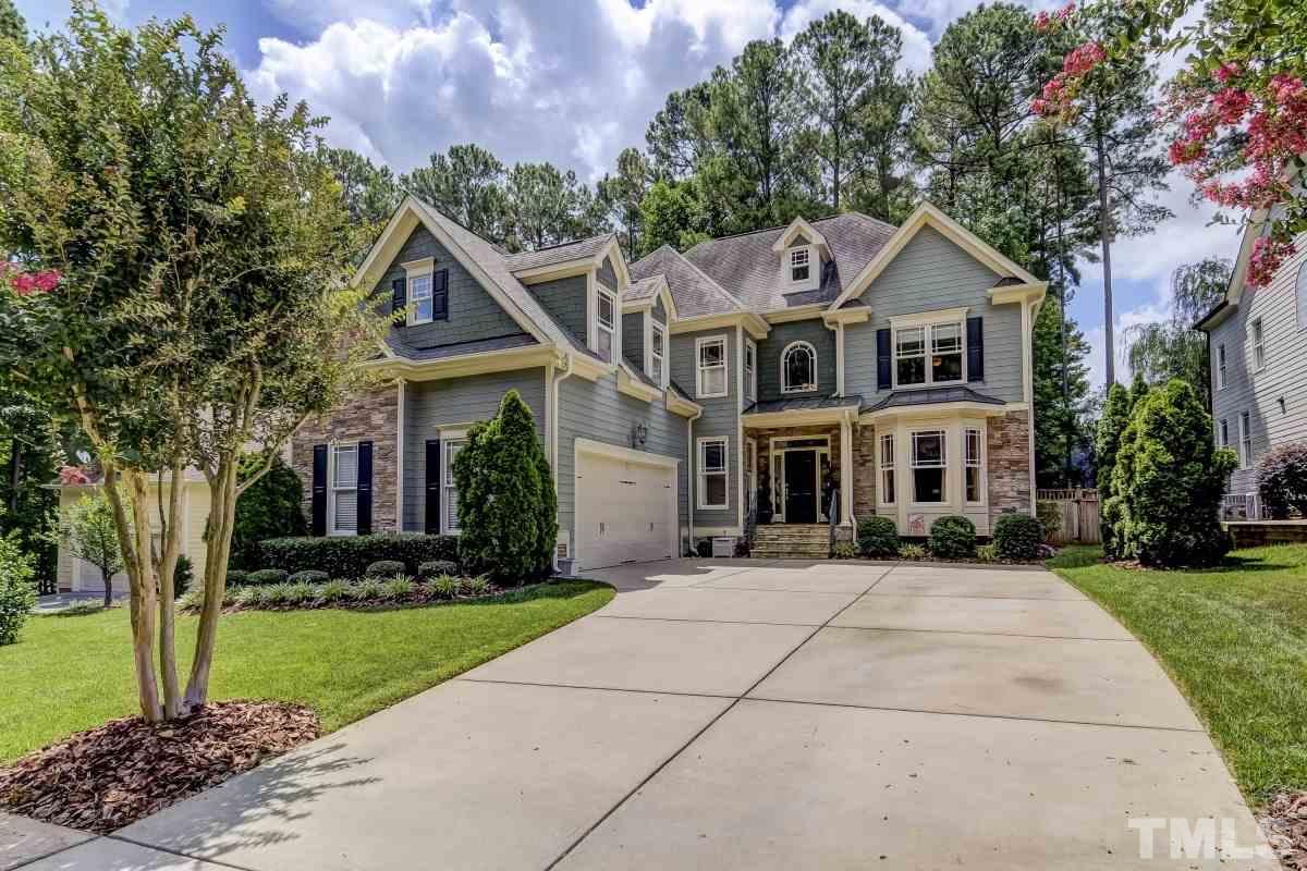 7207 Newport Avenue Raleigh, NC 27613 - Photo 1 of 25 a front view of a house with a yard