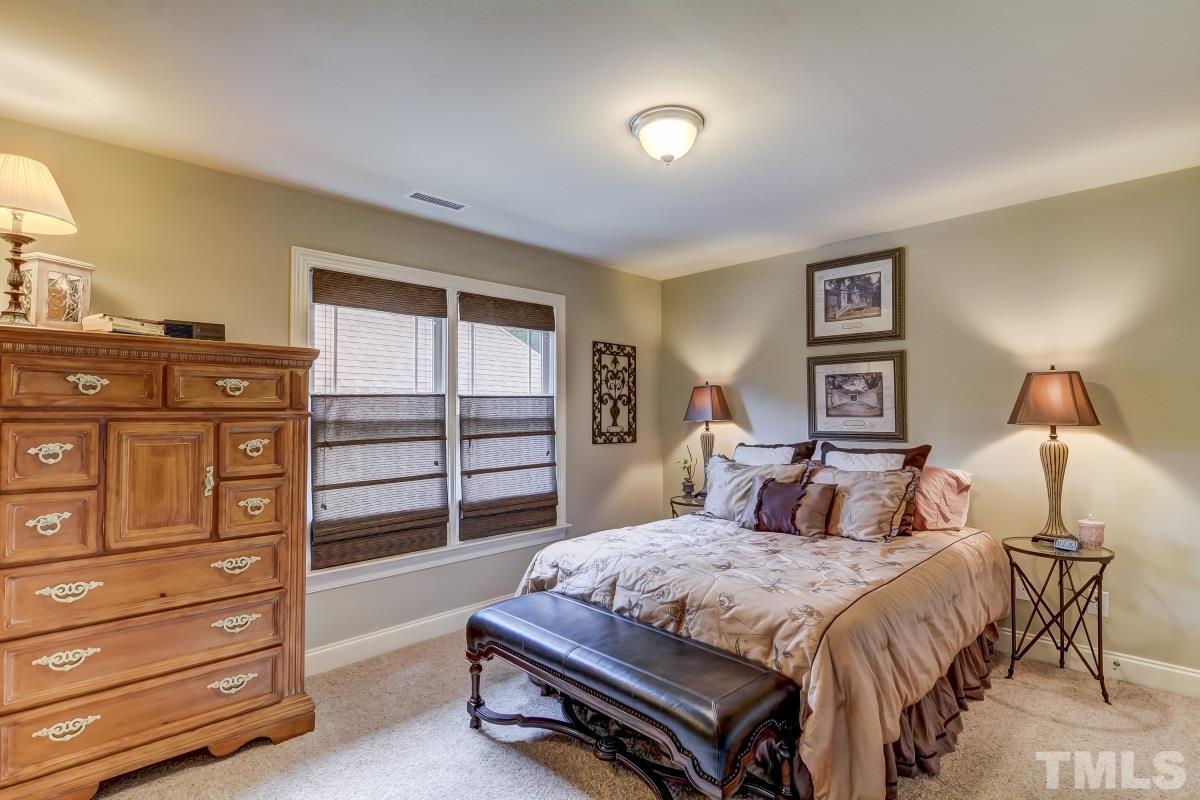 7207 Newport Avenue Raleigh, NC 27613 - Photo 16 of 25 a bedroom with a bed and a closet
