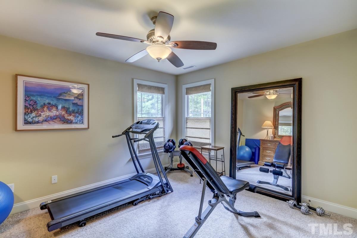 7207 Newport Avenue Raleigh, NC 27613 - Photo 17 of 25 a view of a room with gym equipment