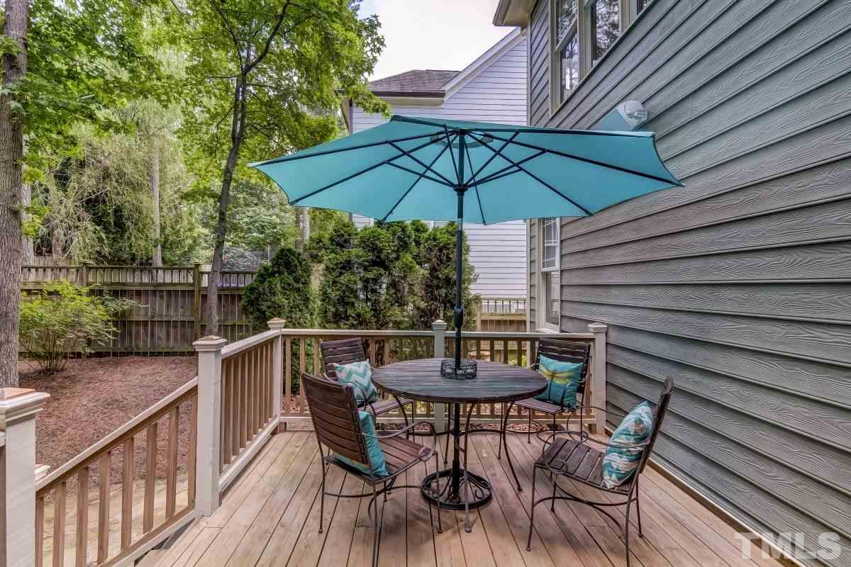 7207 Newport Avenue Raleigh, NC 27613 - Photo 24 of 25 a view of balcony with outdoor seating and wooden deck