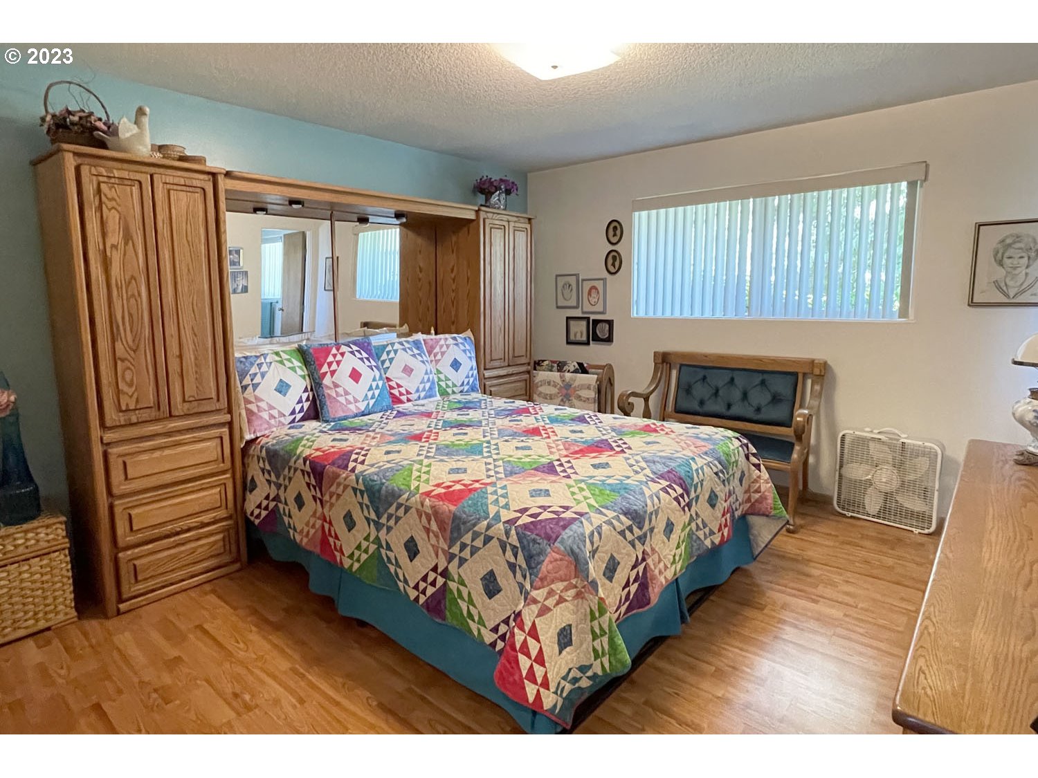 1155 Diamond Street Springfield, OR 97477 - Photo 17 of 34 a bedroom with a bed a mirror on dresser and a window