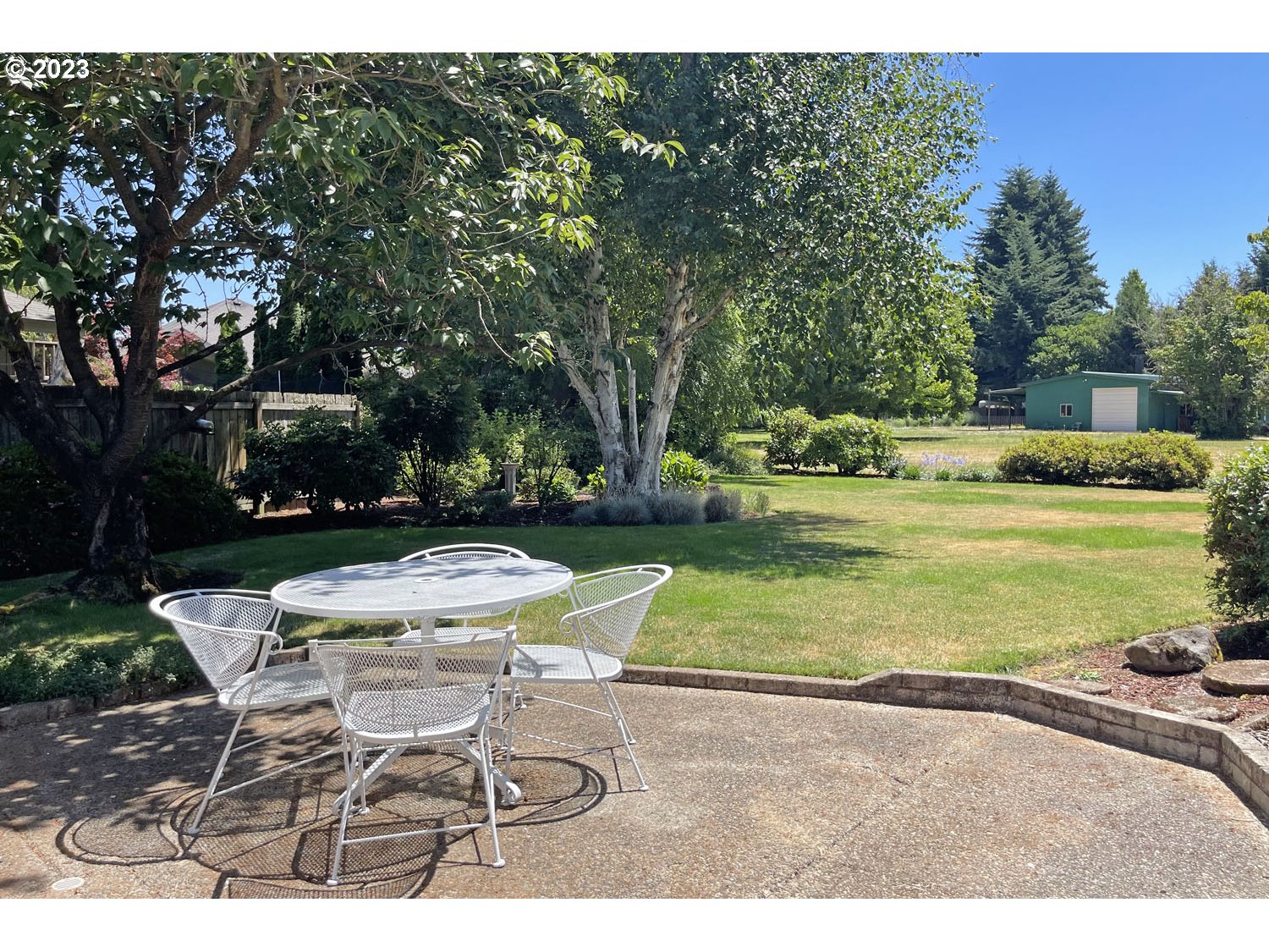 1155 Diamond Street Springfield, OR 97477 - Photo 26 of 34 a view of a table and chairs in backyard of the house