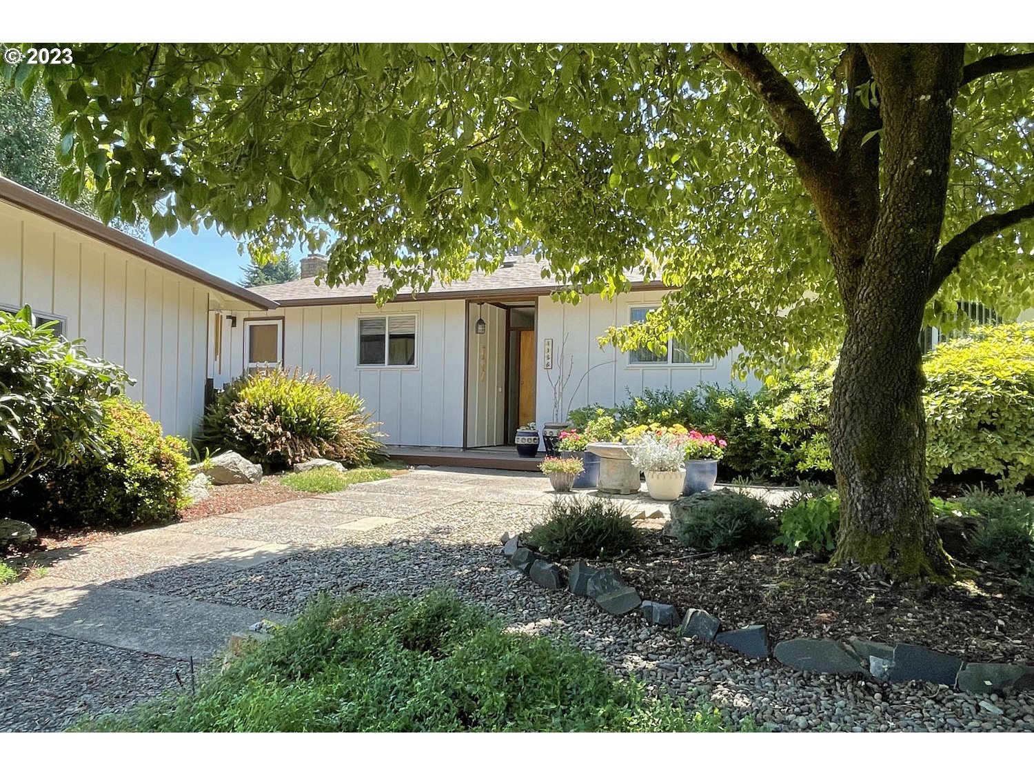 1155 Diamond Street Springfield, OR 97477 - Photo 30 of 34 a front view of a house with garden