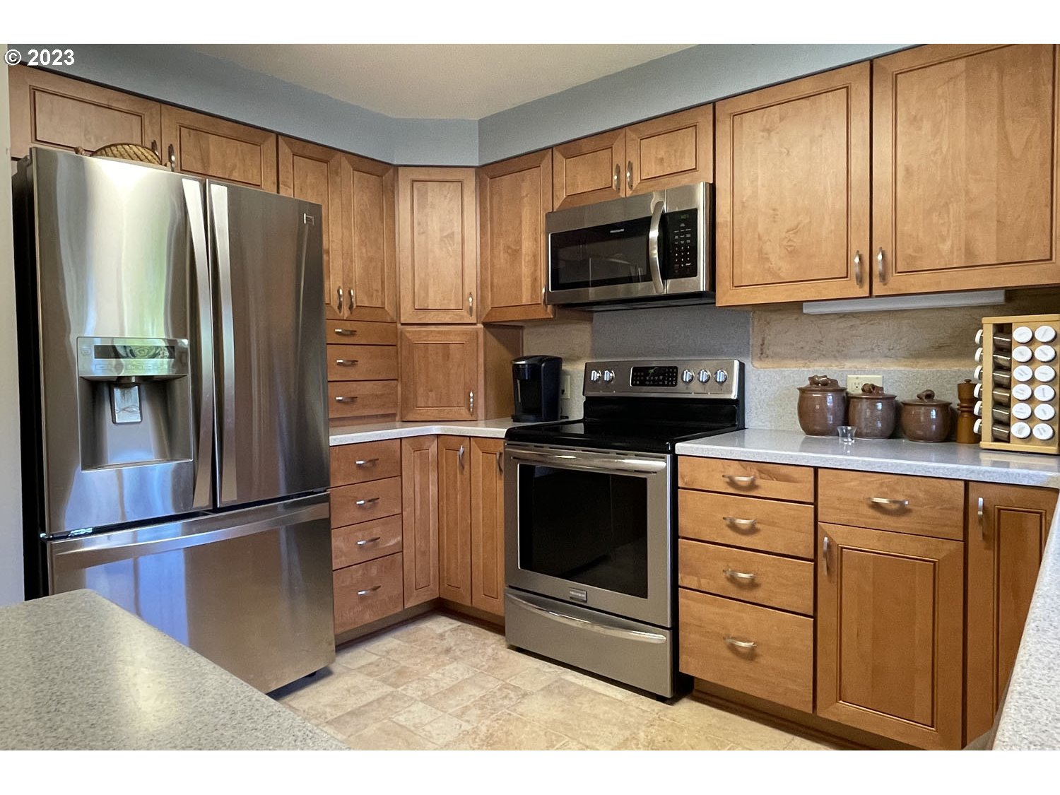 1155 Diamond Street Springfield, OR 97477 - Photo 8 of 34 a kitchen with stainless steel appliances granite countertop a refrigerator stove and microwave