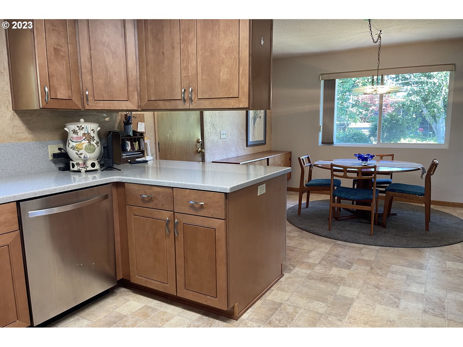 1155 Diamond Street Springfield, OR 97477 - Photo 9 of 34 a kitchen with kitchen island granite countertop a table chairs and a sink