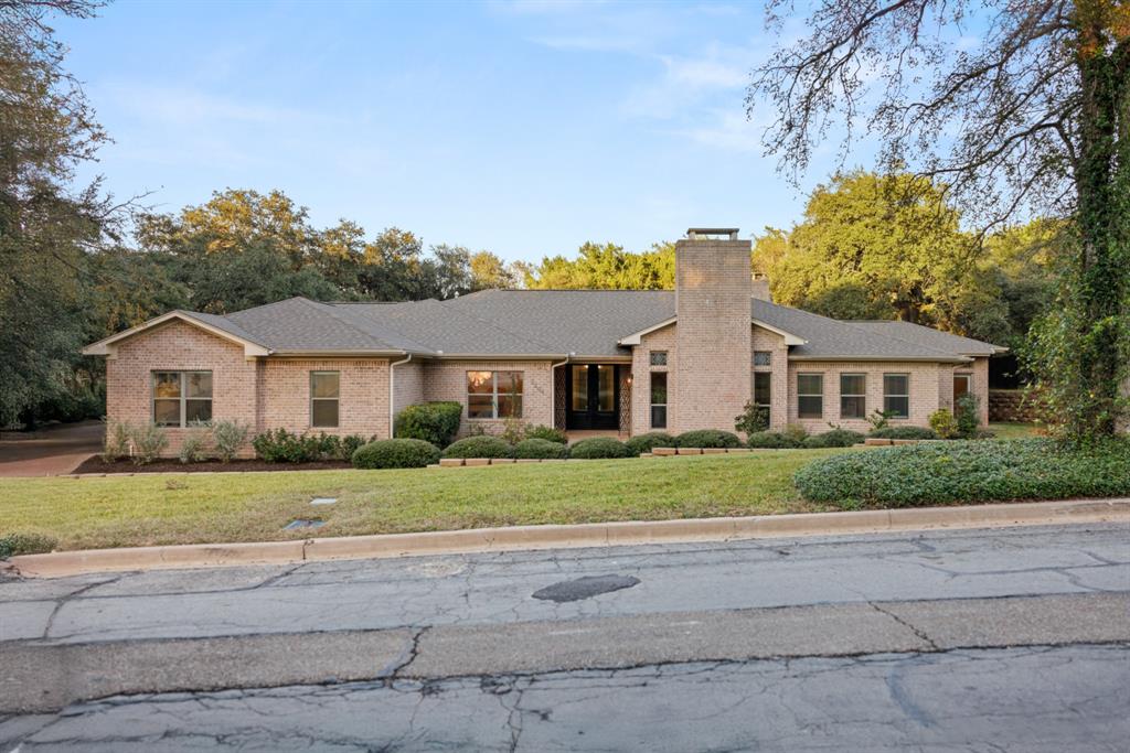 3201 Edward Drive Waco, TX 76708 - Photo 5 of 40 a front view of a house with a yard and garage