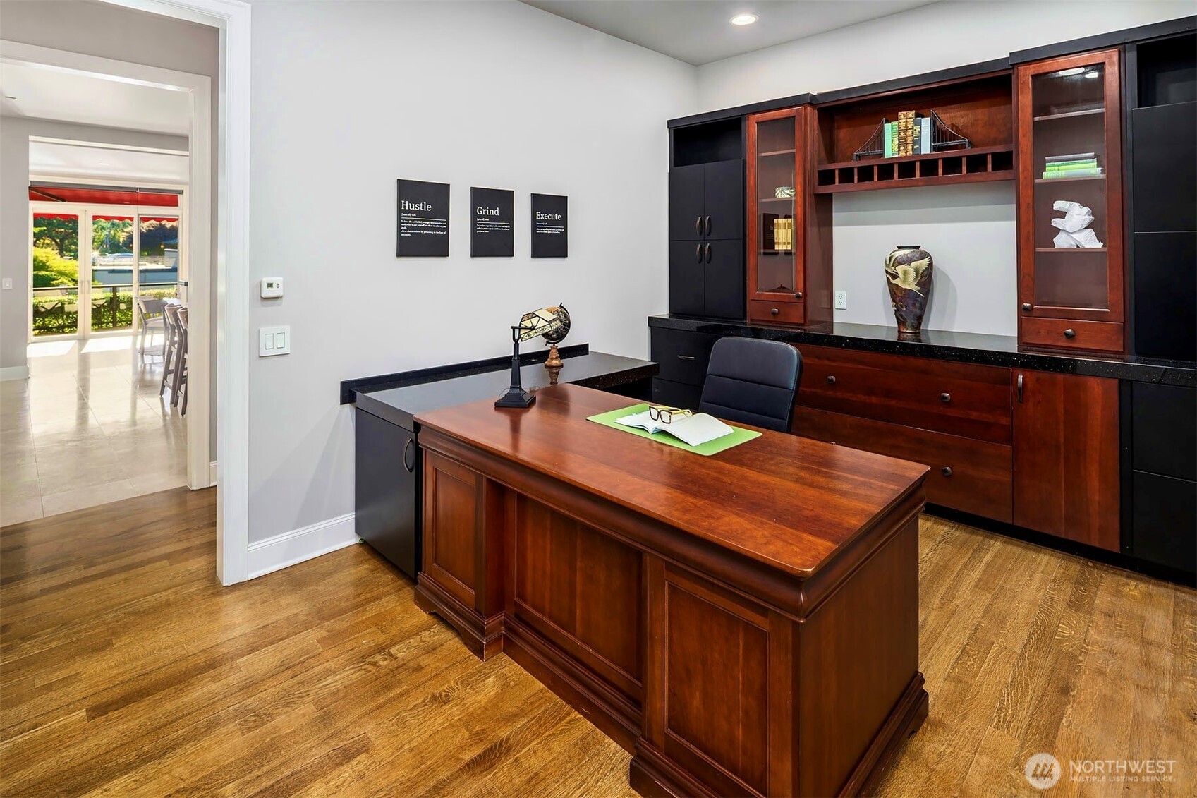 2 Crescent Key Bellevue, WA 98006 - Photo 15 of 38 a room with stainless steel appliances kitchen island granite countertop a refrigerator a stove and a dining table with wooden floor