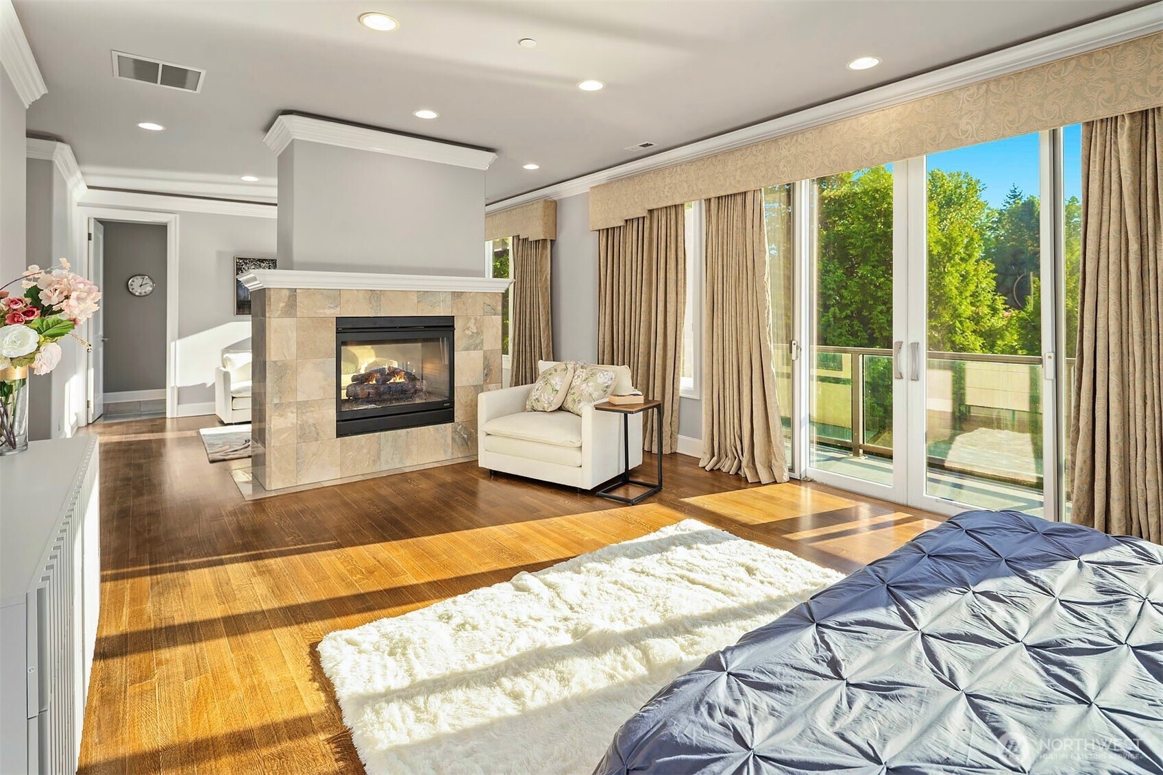 2 Crescent Key Bellevue, WA 98006 - Photo 18 of 38 a spacious bedroom with a large bed and a fireplace