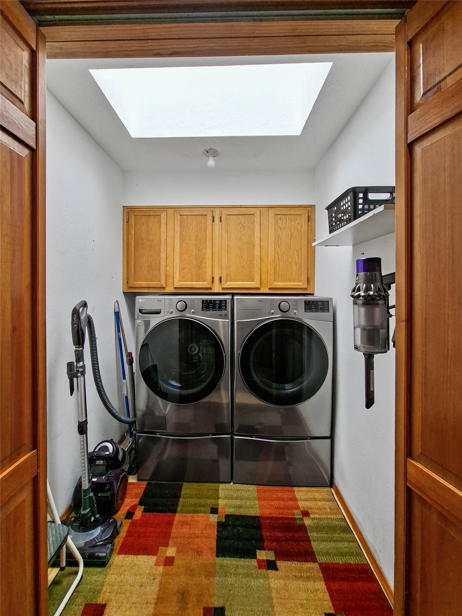 57 Verano Loop Santa Fe, NM 87508 - Photo 18 of 43 Suprisingly large hallway laundry room.