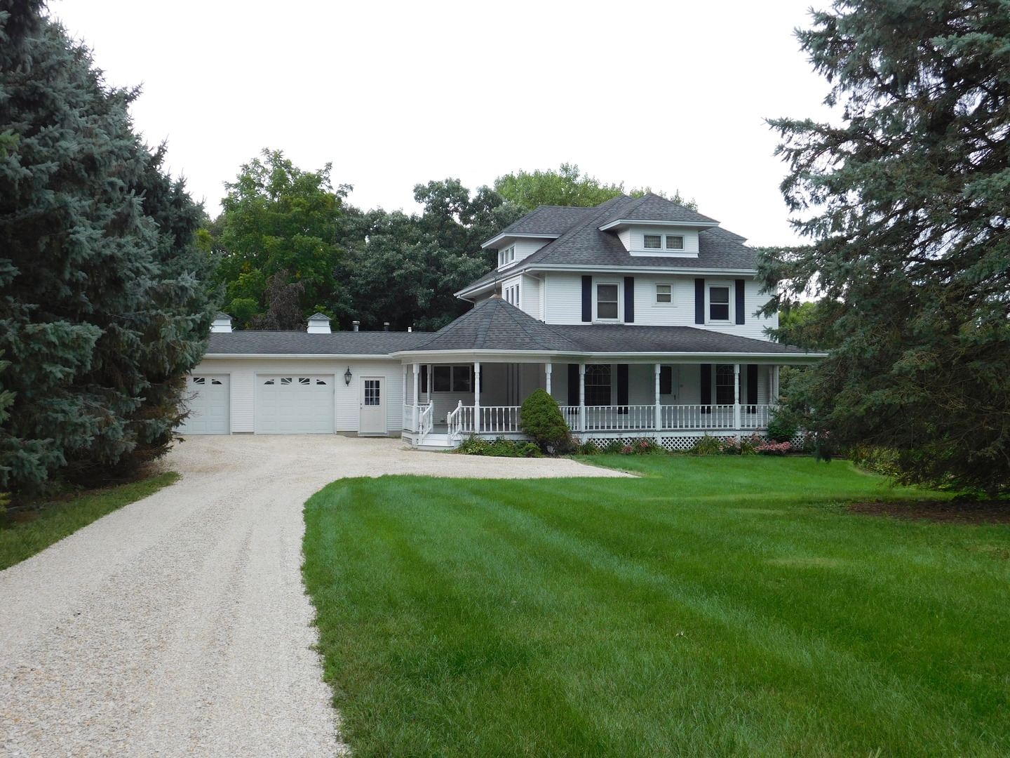 1232 B Steward Road Steward, IL 60553 - Photo 1 of 44 a front view of a house with a garden