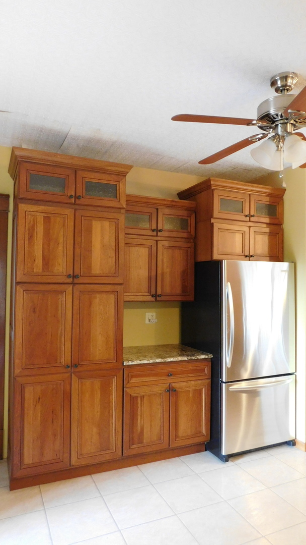 1232 B Steward Road Steward, IL 60553 - Photo 20 of 44 a kitchen with stainless steel appliances granite countertop a refrigerator and a cabinets