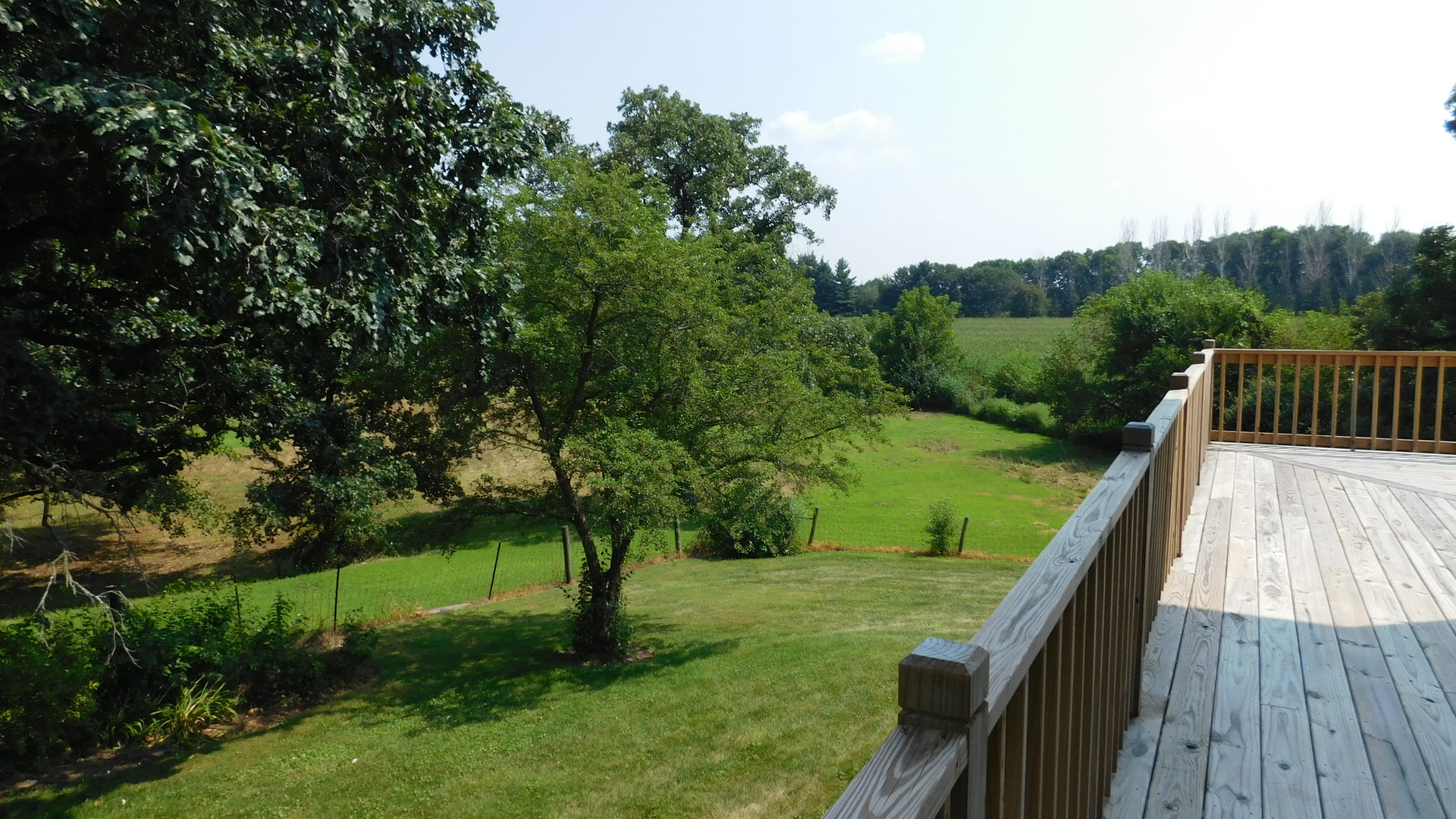 1232 B Steward Road Steward, IL 60553 - Photo 22 of 44 a view of deck with a big yard and potted plants