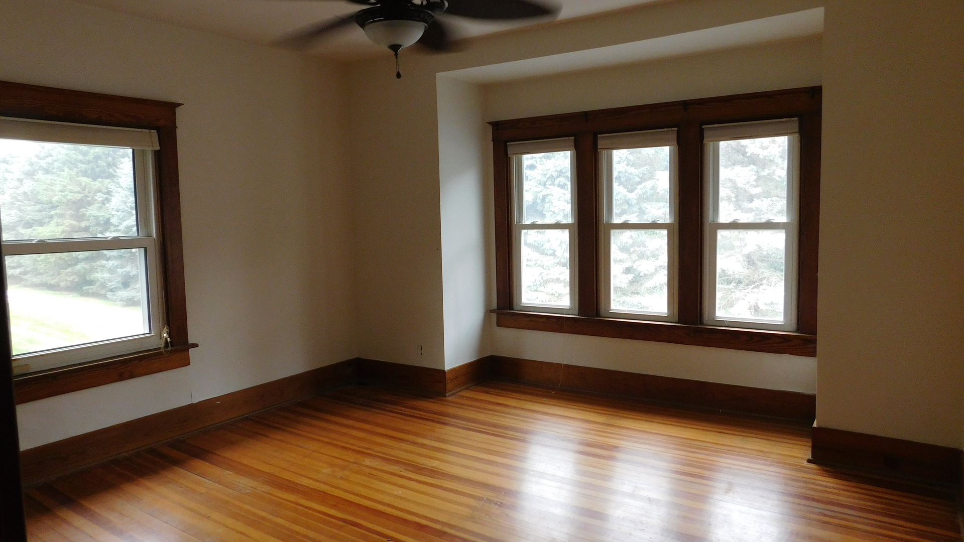 1232 B Steward Road Steward, IL 60553 - Photo 26 of 44 a view of an empty room with wooden floor and a window
