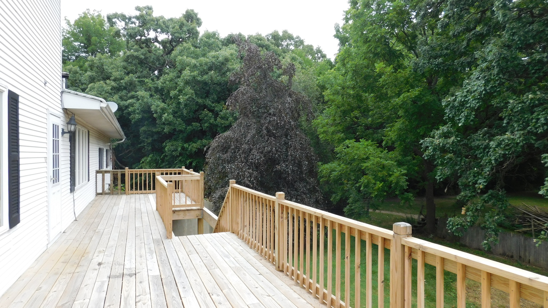 1232 B Steward Road Steward, IL 60553 - Photo 9 of 44 a view of backyard with deck and trees