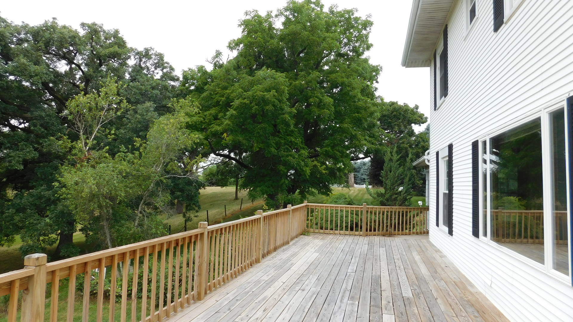 1232 B Steward Road Steward, IL 60553 - Photo 10 of 44 a view of balcony with wooden floor and fence