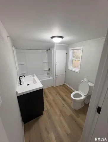 a view of a bathroom with a sink and mirror