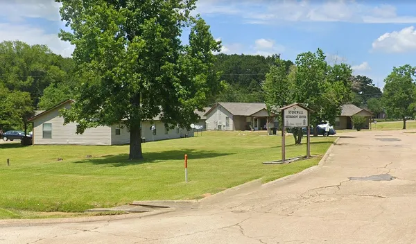 a view of a swimming pool with a yard