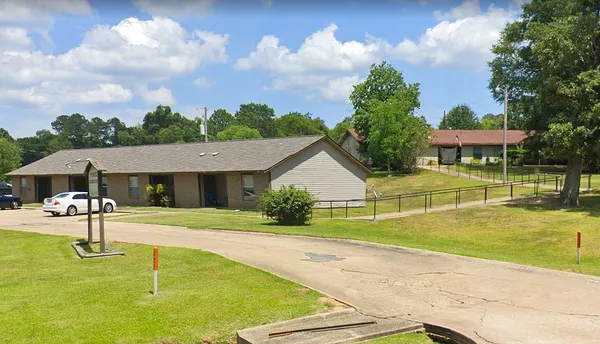 a view of a house with swimming pool and a yard