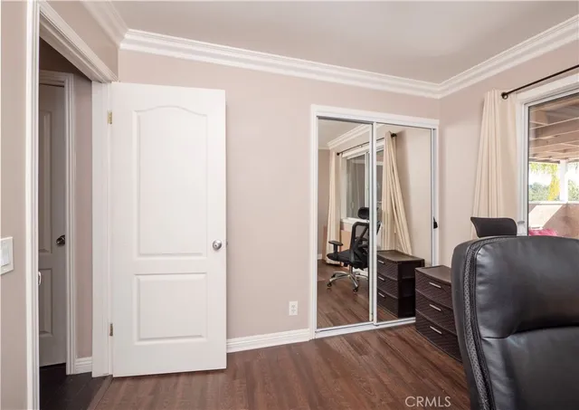 a living room with furniture toys and a large window