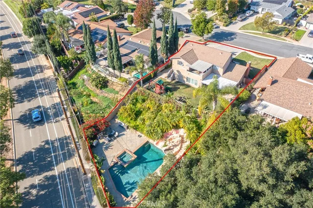 an aerial view of residential house and parking space