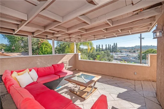 a bathroom with a toilet and a shower curtain