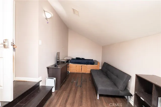 a view of a house with a yard and sitting area