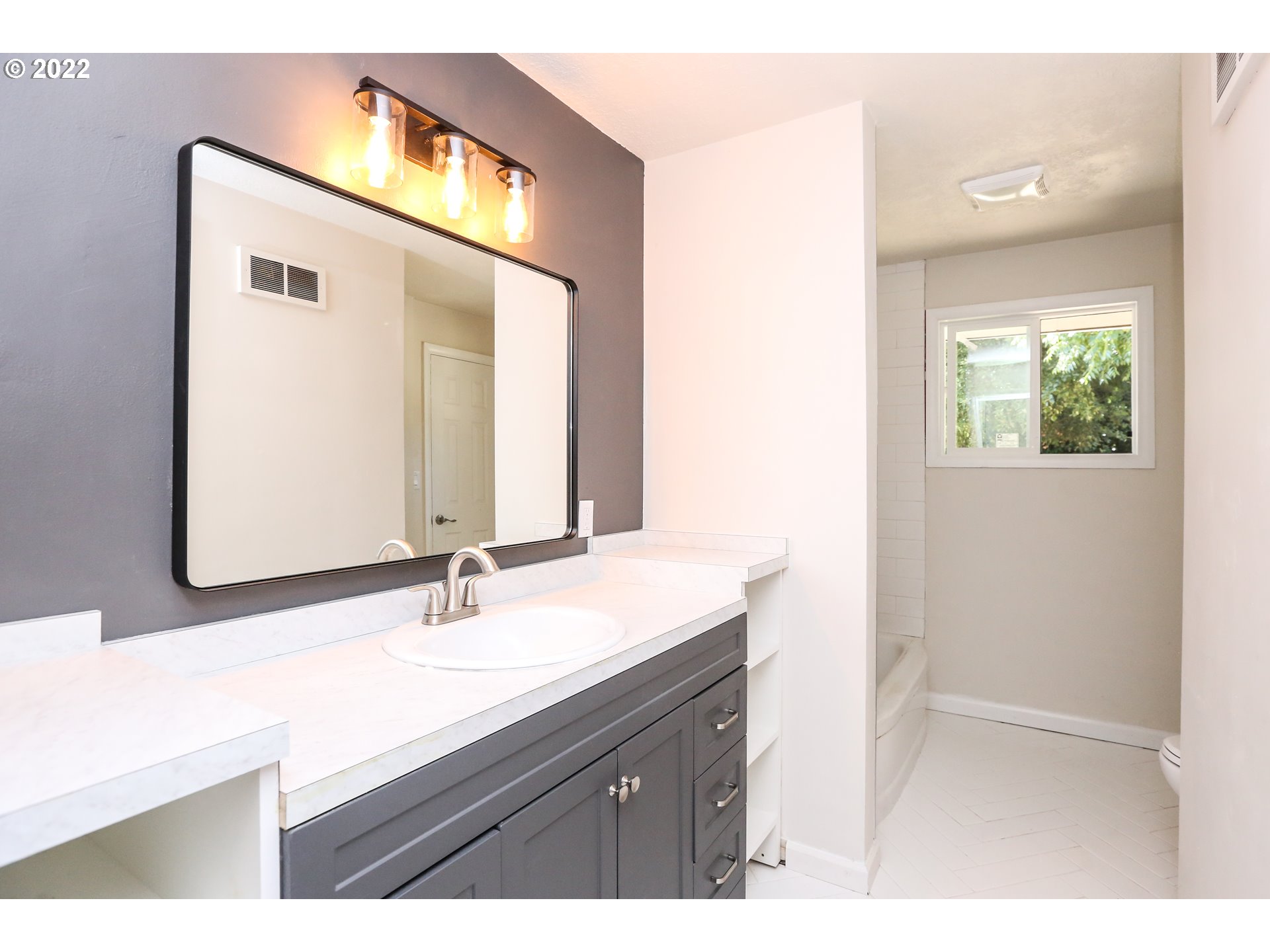 2884 Manor Drive Springfield, OR 97477 - Photo 12 of 17 a bathroom with a sink and a mirror