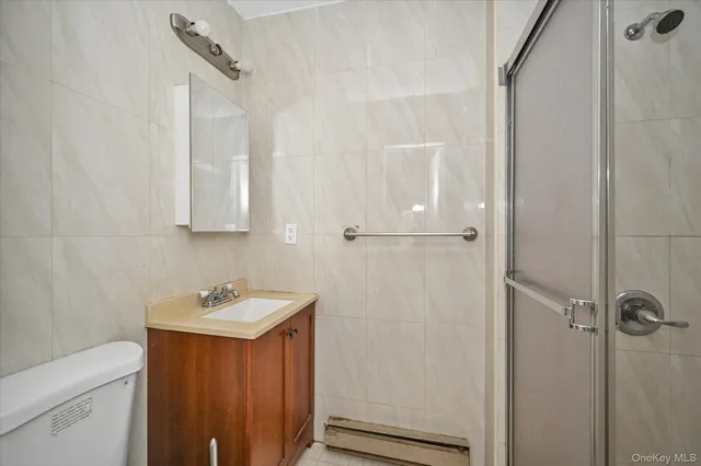 a view of a room with gym equipment and windows