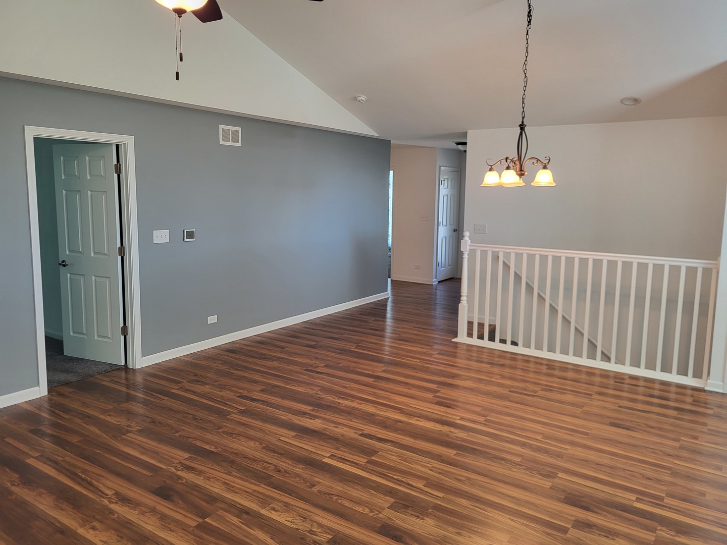 4509 Island Road Harvard, IL 60033 - Photo 12 of 40 a view of a room with wooden floor and staircase