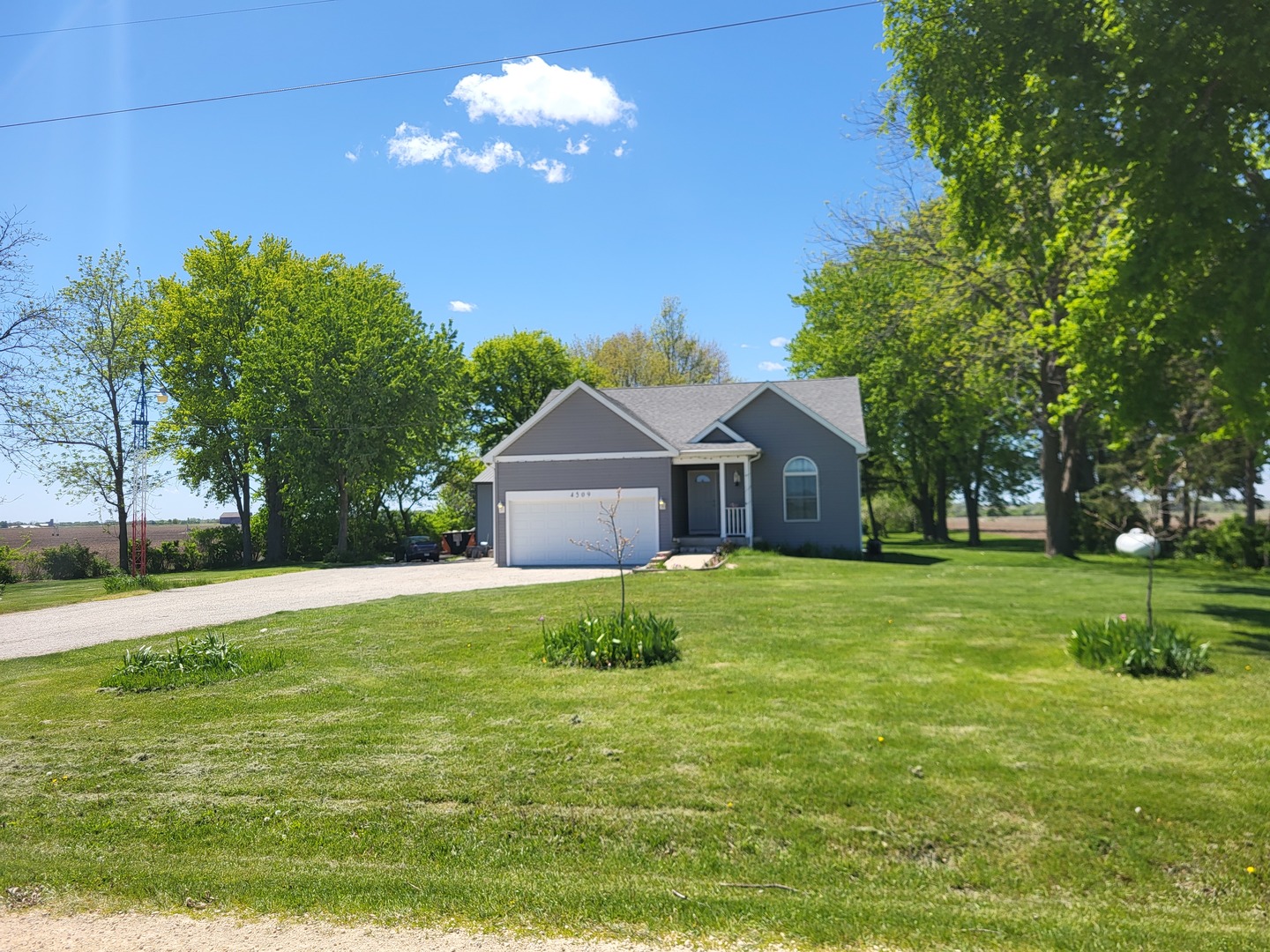 4509 Island Road Harvard, IL 60033 - Photo 2 of 40 a house view with a outdoor space