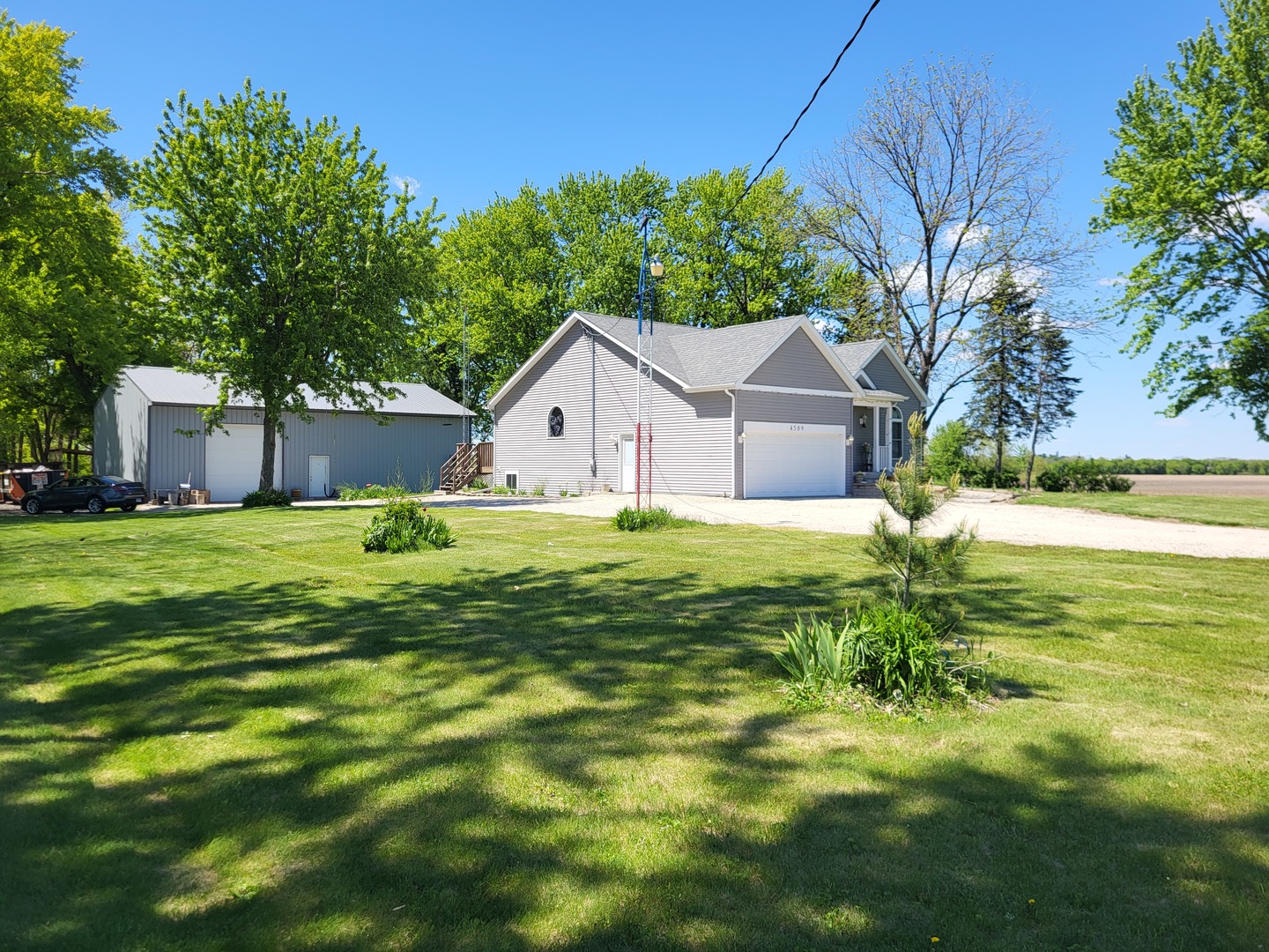 4509 Island Road Harvard, IL 60033 - Photo 3 of 40 a view of a house with a yard