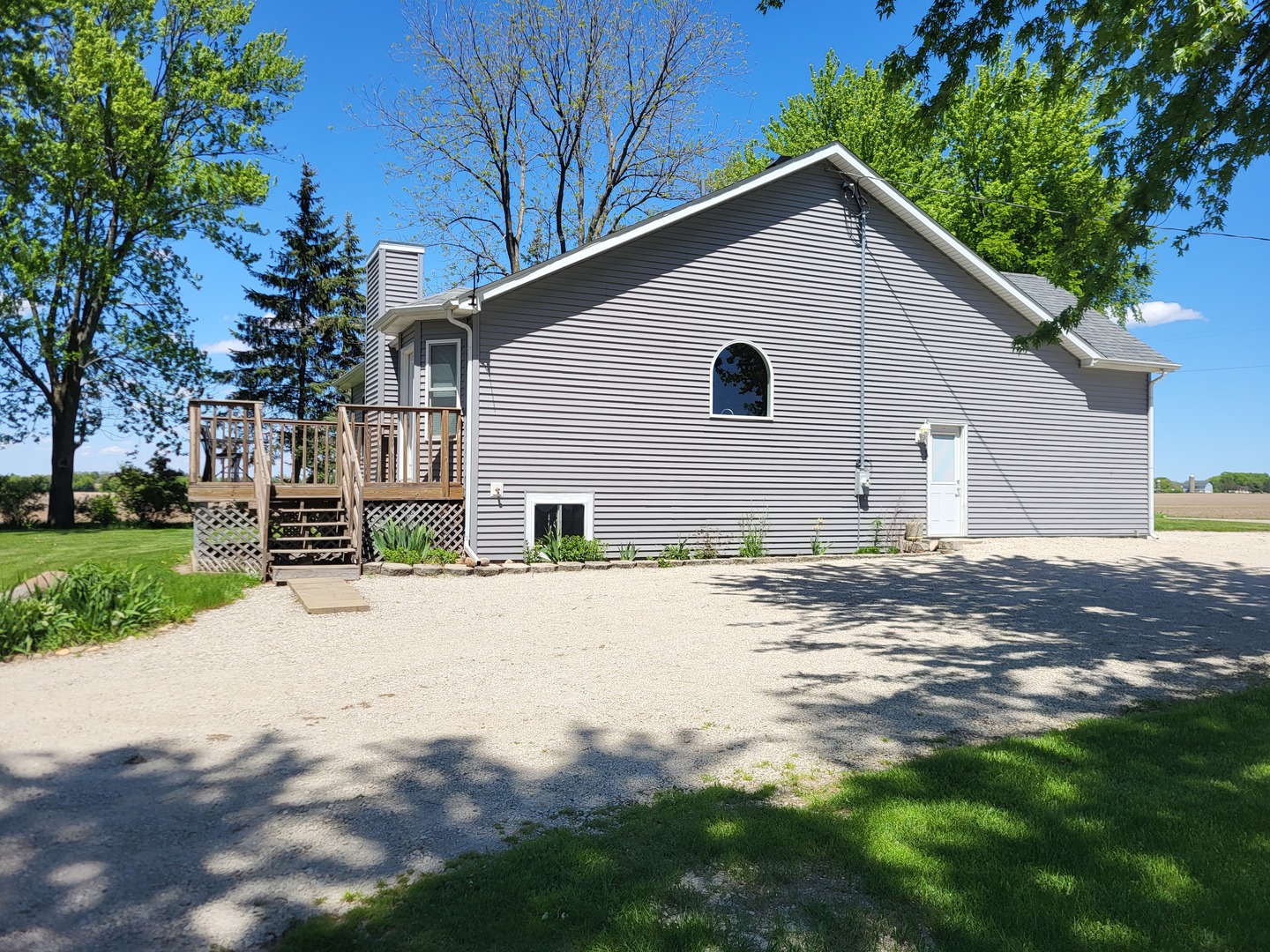4509 Island Road Harvard, IL 60033 - Photo 4 of 40 a view of a house with yard and a garden