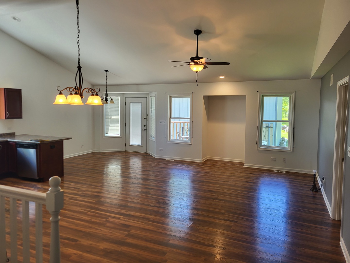 4509 Island Road Harvard, IL 60033 - Photo 8 of 40 a view of an empty room with window and wooden floor