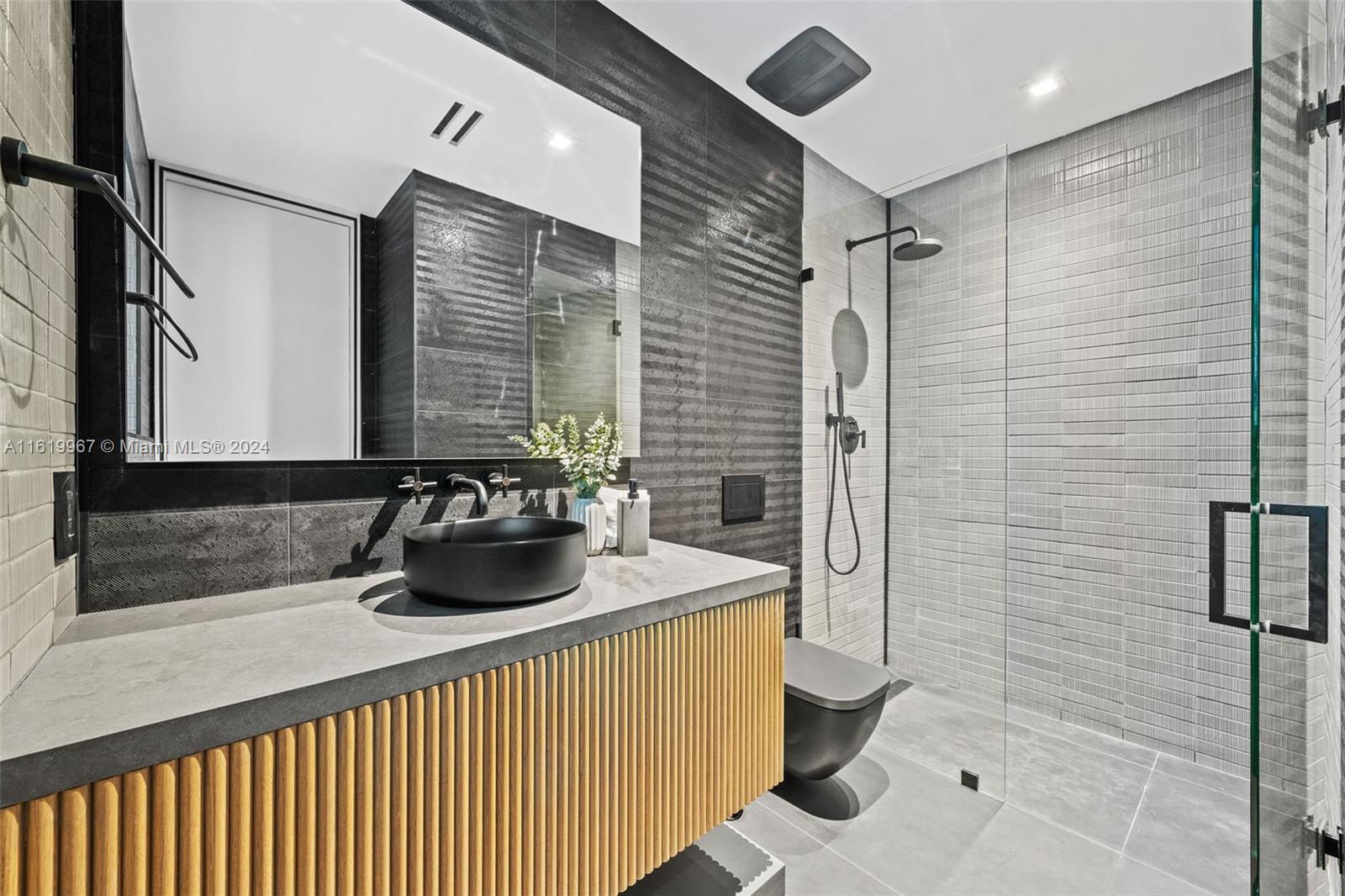 4800 Bay Point Road Miami, FL 33137 - Photo 15 of 74 a bathroom with a sink a toilet and shower