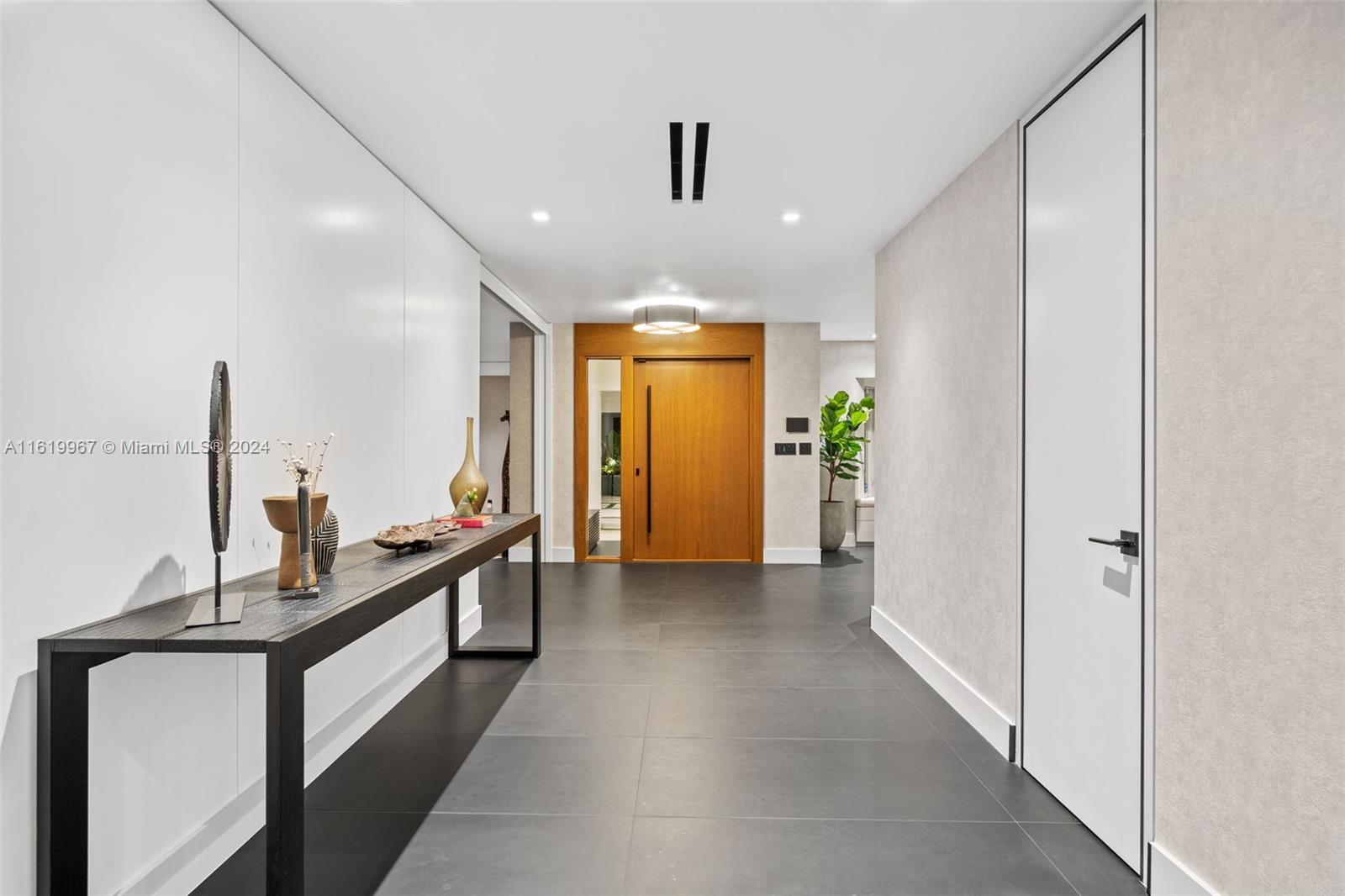 4800 Bay Point Road Miami, FL 33137 - Photo 21 of 74 a view of a hallway with living room